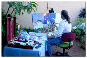 Here J&acirc;ree sits in the garden creating and painting with comfort.
